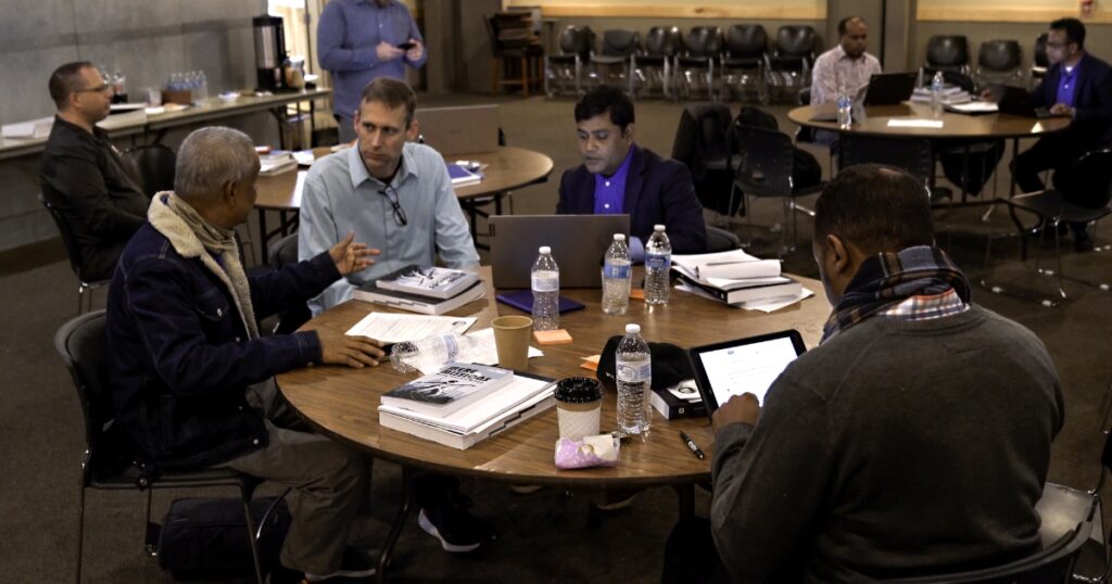 Urban church plant team working on strategy with World Impact.